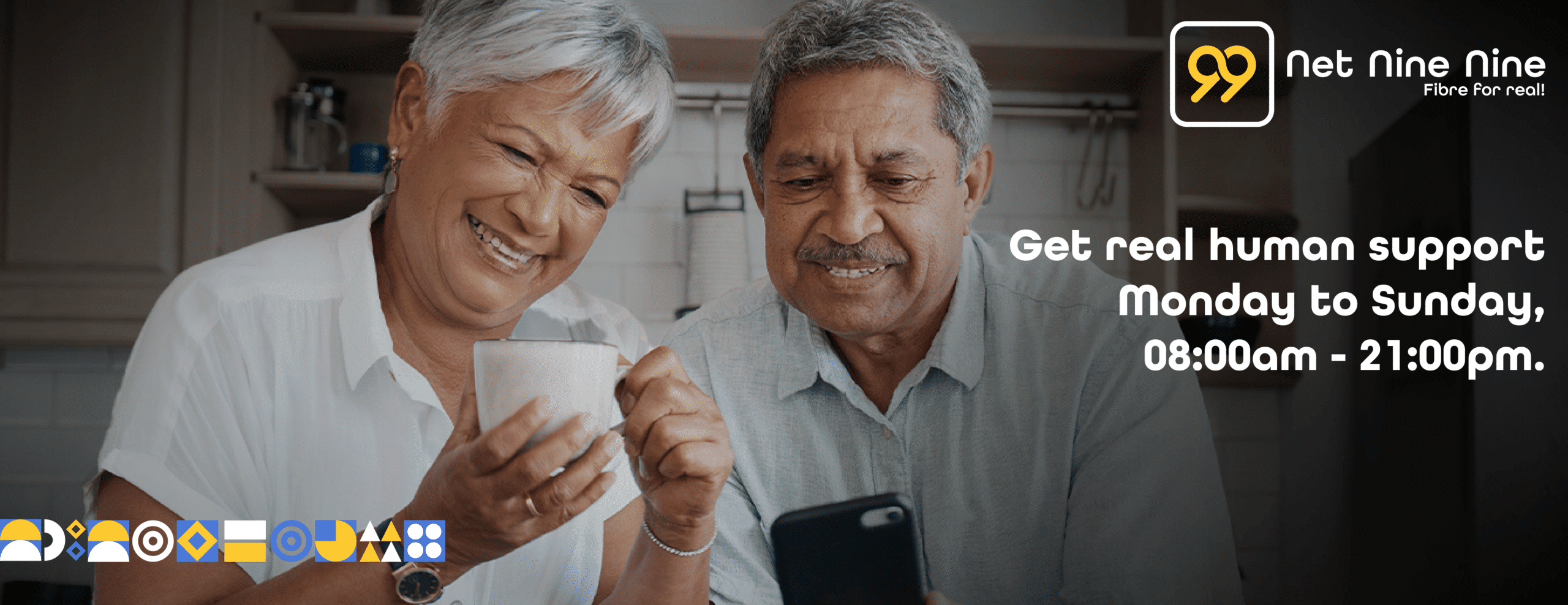 older woman and man smiling at cellphone